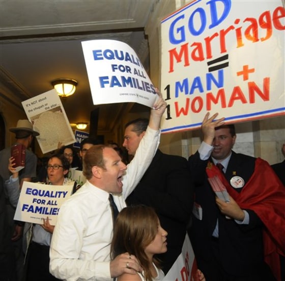 Protesters for and against the same-sex marriage bill protest in the halls of the Capitol in Albany, N.Y., on Monday.